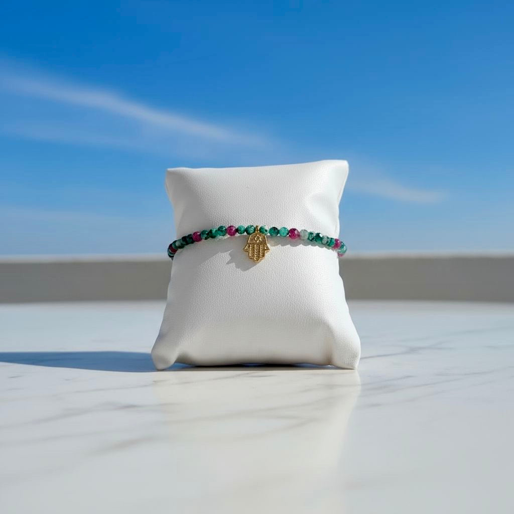 Collection of ruby in zoisite beaded bracelets with charm