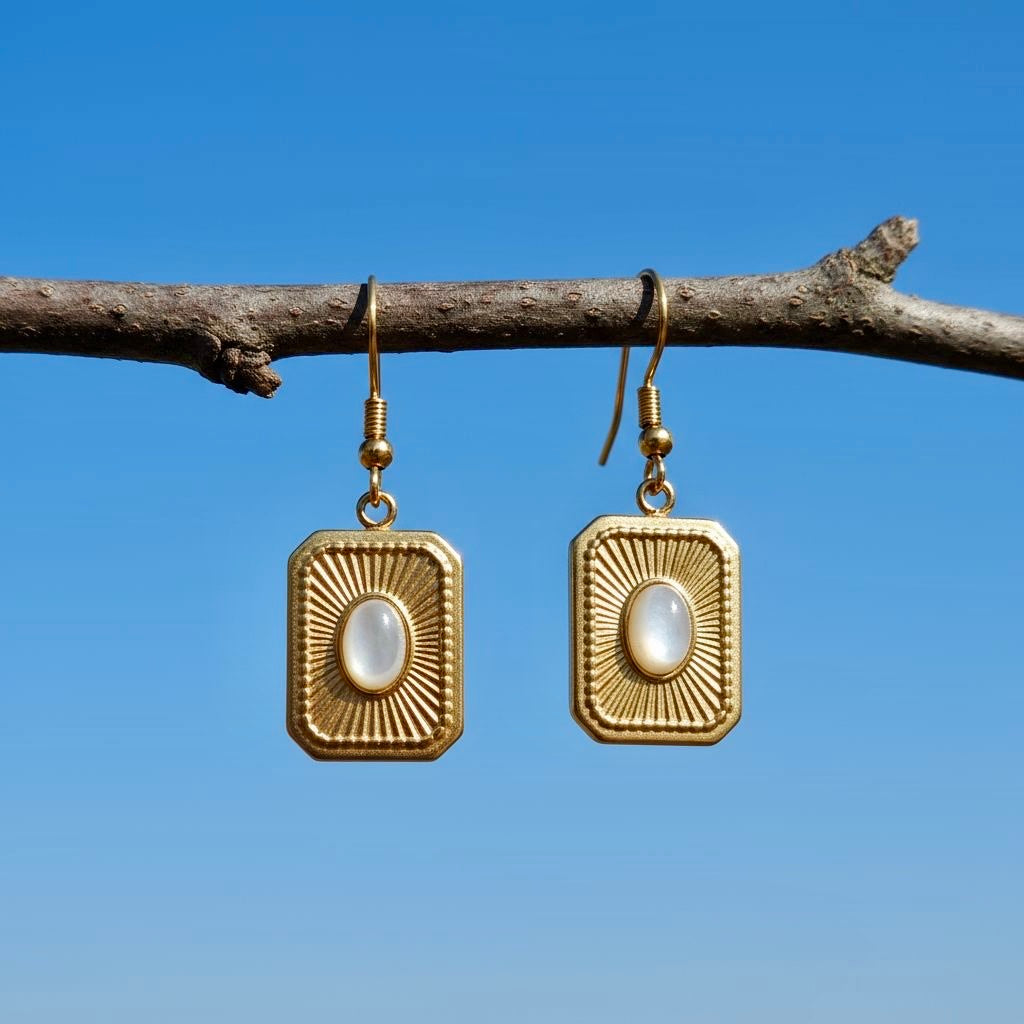 Gouden roestvrijstalen oorbellen met schelp