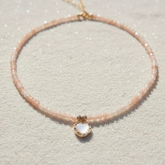 Zonnesteen ketting met hartvormige hanger met parel