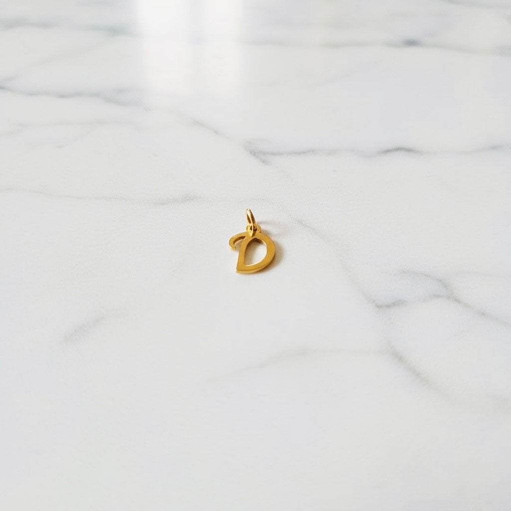 Aquamarijn armband met gouden muntjes en letter