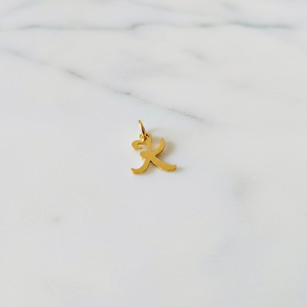 Aquamarijn armband met gouden muntjes en letter