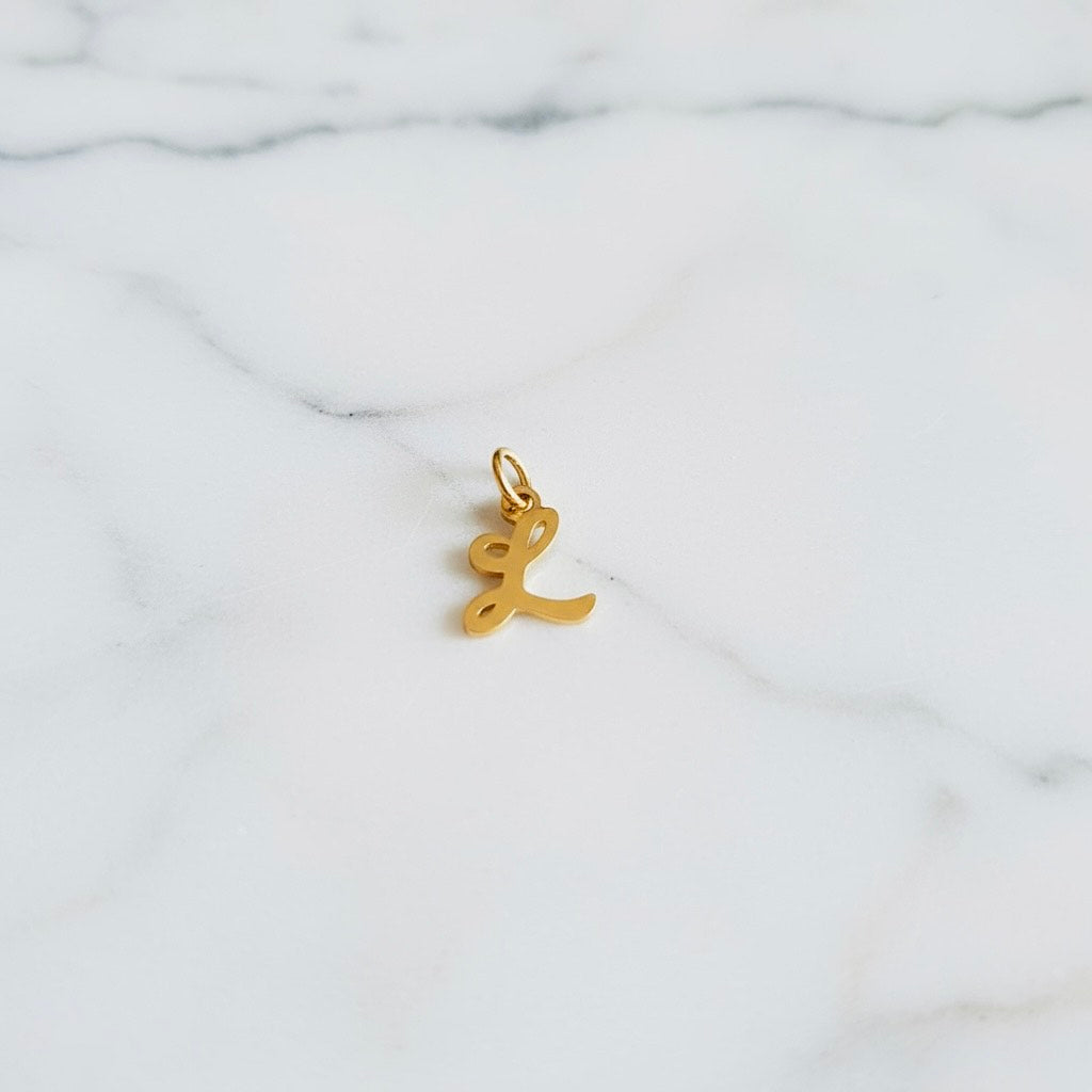 Aquamarijn armband met gouden muntjes en letter