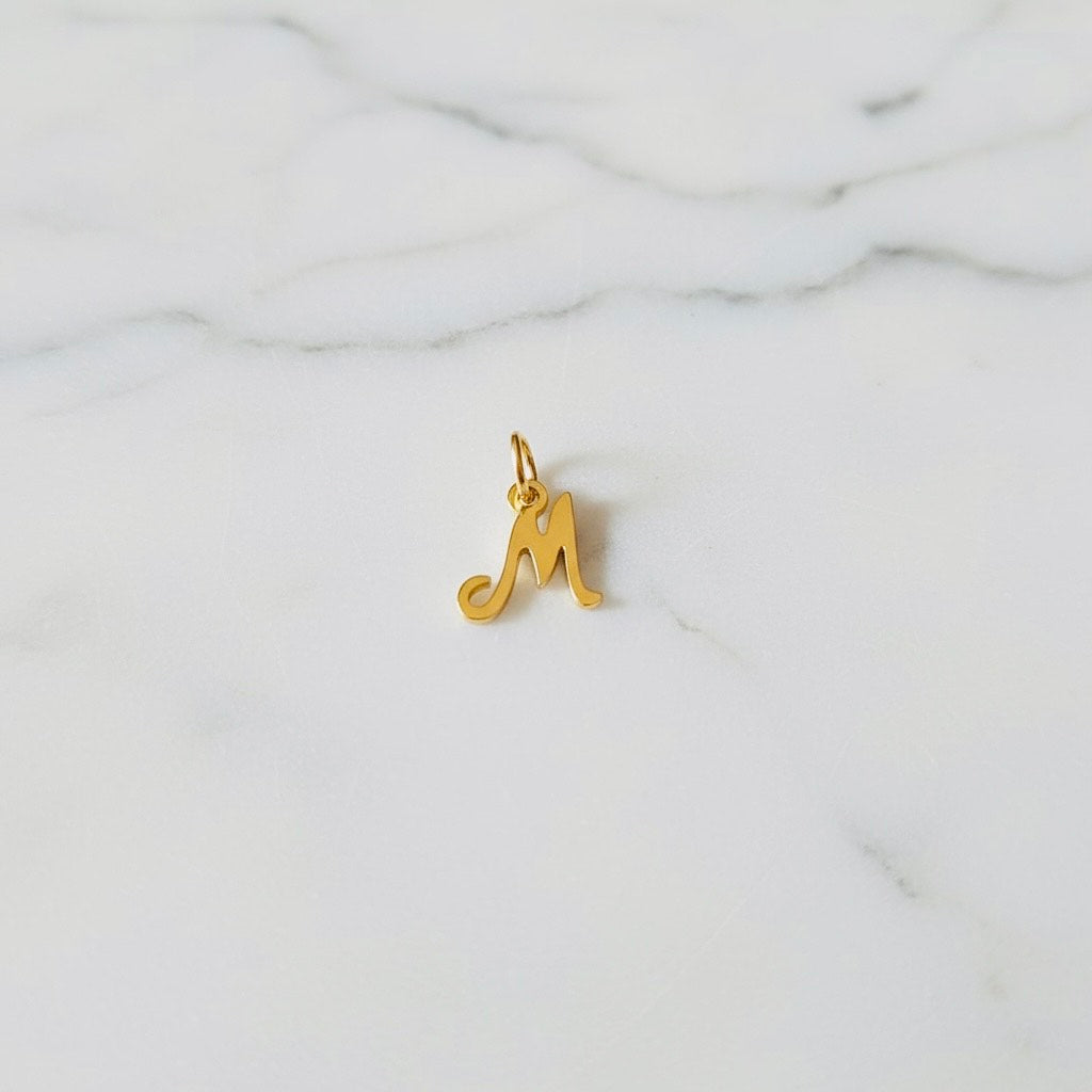 Aquamarijn armband met gouden muntjes en letter