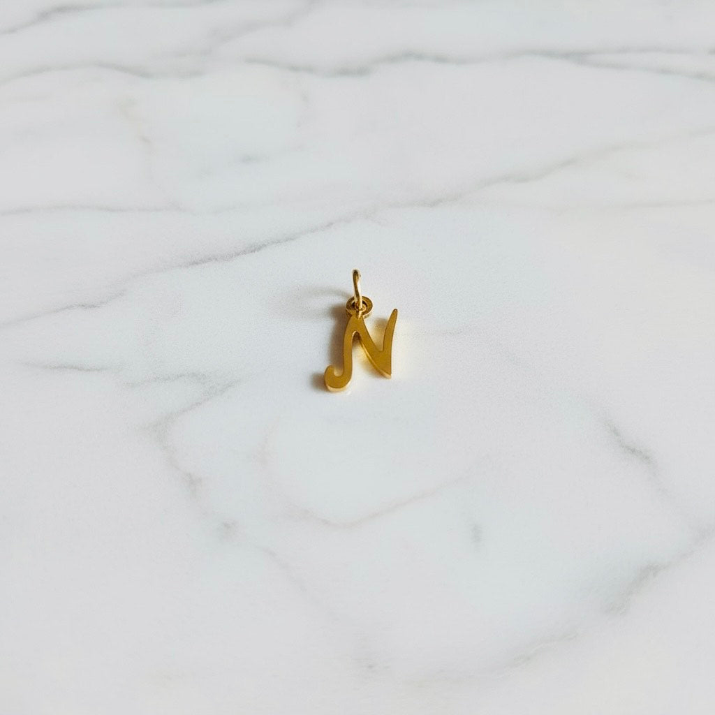 Aquamarijn armband met gouden muntjes en letter