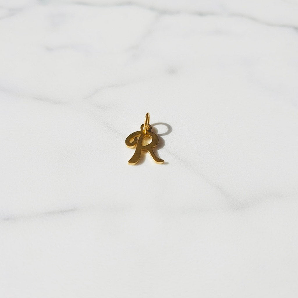 Aquamarijn armband met gouden muntjes en letter