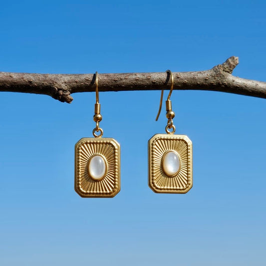 Gouden roestvrijstalen oorbellen met schelp