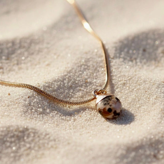 Gouden roestvrijstalen snake ketting met dalmatiër jaspis